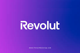The image shows the Revolut logo in white text centered on a gradient background transitioning from purple on the left to blue on the right. The website "www.fintechbooster.com" is at the bottom.