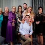 Group of friends enjoying a fun photo session at a studio booth in Ireland.