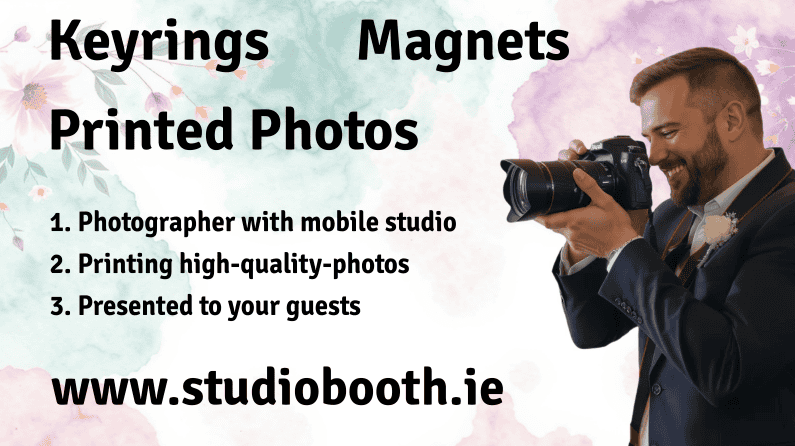 A man in a suit holds a camera and takes a photo. Text on the image advertises keyrings, magnets, printed photos, and a photographer with a mobile studio from www.studiobooth.ie, with a floral background.