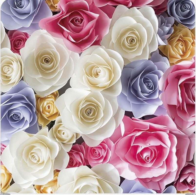 A collection of hand-crafted paper roses in shades of white, pink, yellow, and lavender.